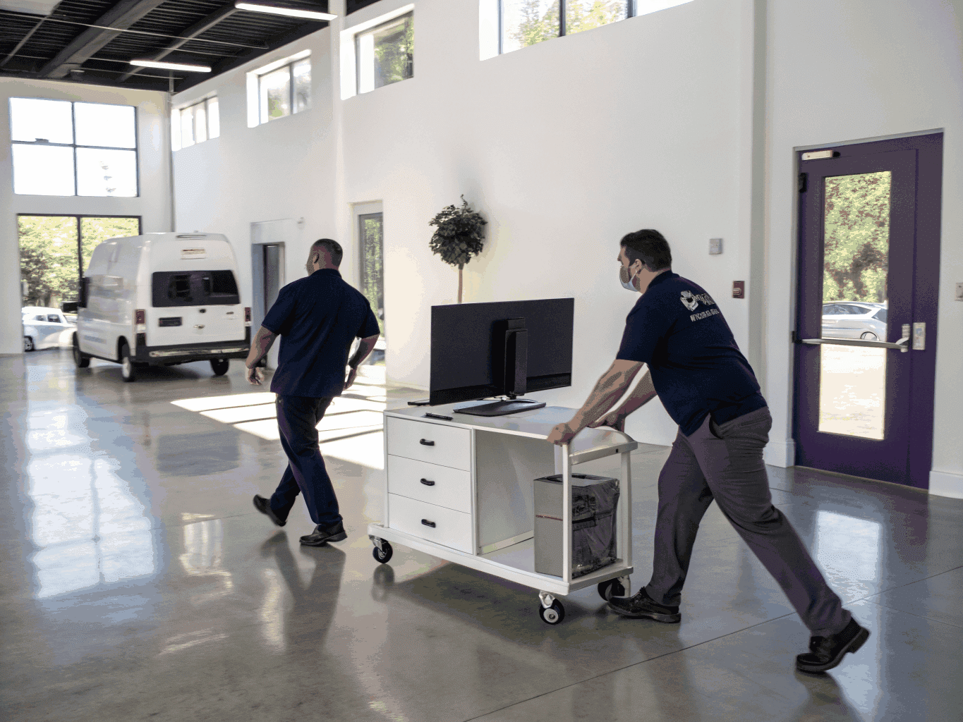 Workers clearing out an office space in Kanata